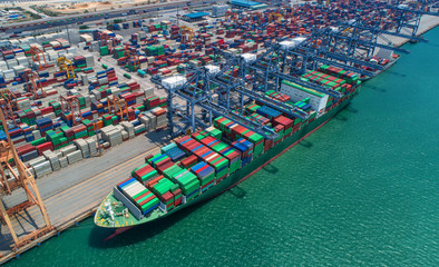 container ship in import export and business logistic.By crane ,Trade Port , Shipping, cargo to...