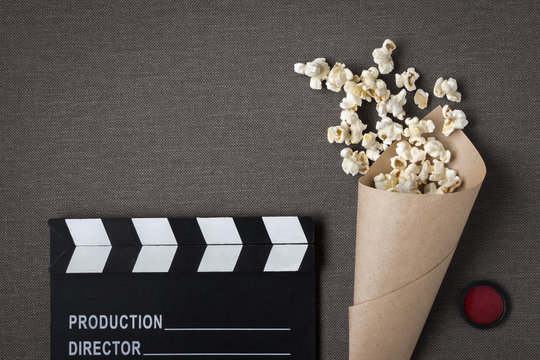 Clapperboard and package with popcorn