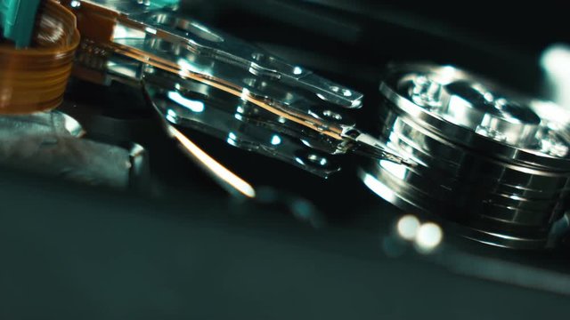Computer techologies. data storage. Server racks, open computer hard drive. The inside of the disk, the spindle and the reading head. Storage and transfer of large information objects. Information
