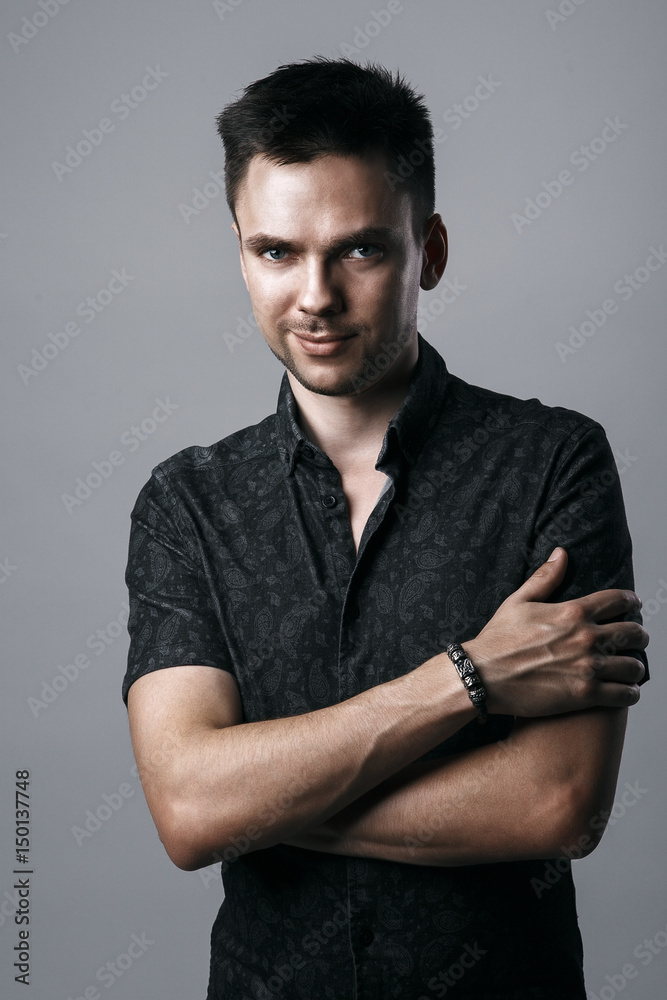 Poster Handsome smiling young man