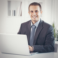 Satisfied Businessman in Office