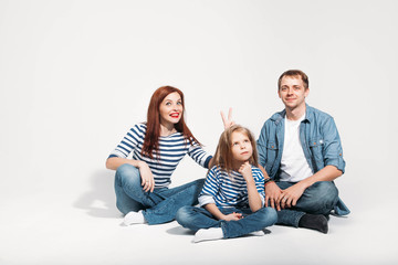 Fototapeta premium Happy family portrait sitting on white background isolated