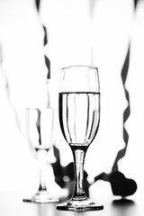 monochrome photo of champagne on white table on white background isolate