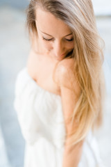 Blonde woman in white dress