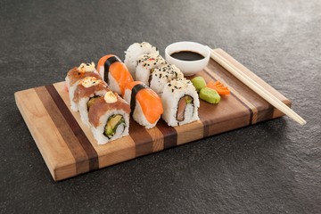 Assorted sushi set served with chopsticks and soy sauce