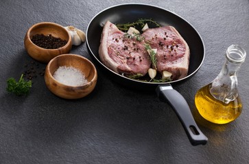 Sirloin chop in frying pan with ingredients