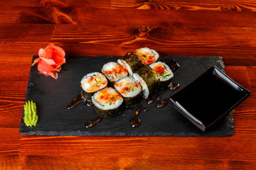 Spicy sushi rolls with sweet honey sauce