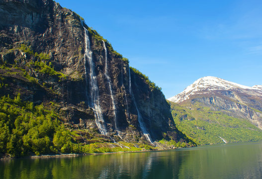 Waterfalls of Geirangerfjord in Norway. The beautiful mountain scenery.