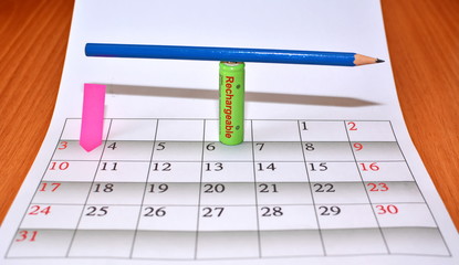 empty space sheet monthly calendar and tab with rechargeable battery and balancing pencil