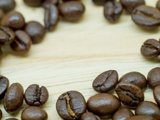 Fresh Coffee beans isolated on Light wood floor