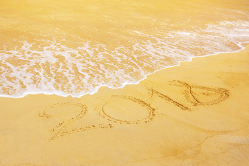 2018 or New Year`s celebration on the sandl beach