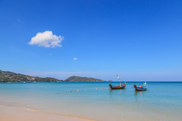 Fototapeta na wymiar Long tail boats at Patong beach, beautiful andaman sea beach at Phuket, Thailand