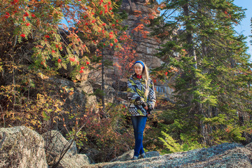 A girl sitting on a rock