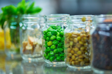 Food ingredients in jars vegetables, cereals