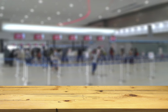 Empty wooden table space platform and blurred Counter check-in background for product display montage