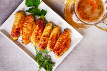Buffalo chicken wings and glass of beer. View from above, top studio shot