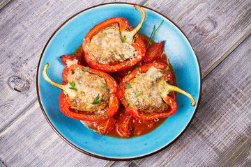 Bell pepper stuffed with meat and vegetables. View from above, top studio shot