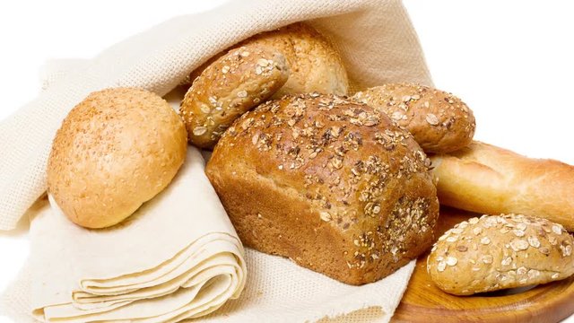 assortment of baked bread on wooden board intro motion slow