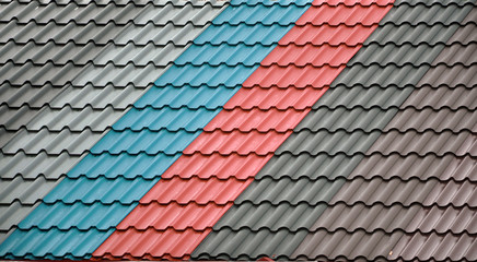Architectural background. Texture of a metal roof tiles of black, blue and red colors. - 150181741