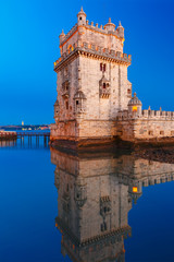 Belem Tower or Tower of St Vincent on the bank of the Tagus River during evening blue hour, Lisbon, Portugal