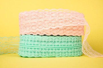 Closeup of ribbon roll over colorful background