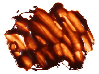 Hot melted chocolate pouring isolated on white background, with clipping path