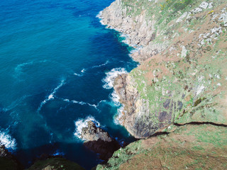 Coast line in Cornwall with blue ocean