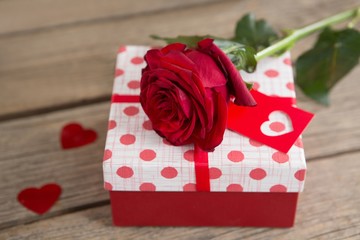 Gift box surrounded with rose