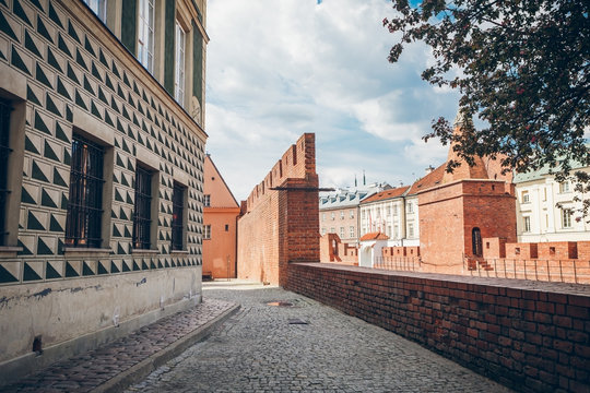 Warsaw Barbican fortress (castle) is in the capital city of Poland. Old town is the historic center of Warsaw. Sights of Poland. Spring sunny day. Travel (vacation), architecture concept.