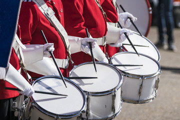 Drummers in red uniforms on a row