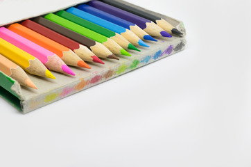 Fototapeta premium The color pencil stacked in the old paper box isolate background with copyspace. Concept Education .