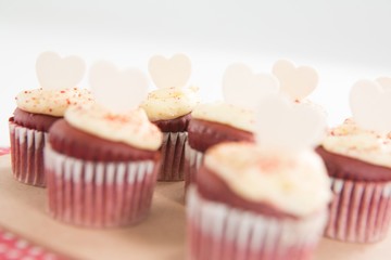 Cup cakes on heart shape paper