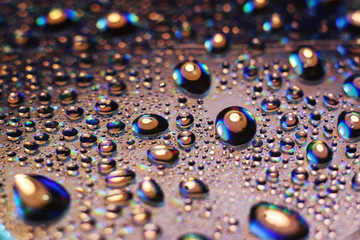 Colored rainbow water droplets on the disc