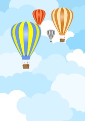Flying color hot air balloons with hanging wicker basket with background weight with white and blue clouds
