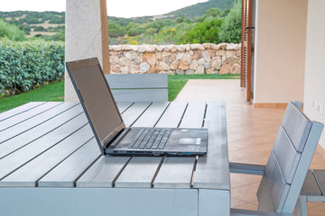 Laptop, tablet on wooden table, ready to work