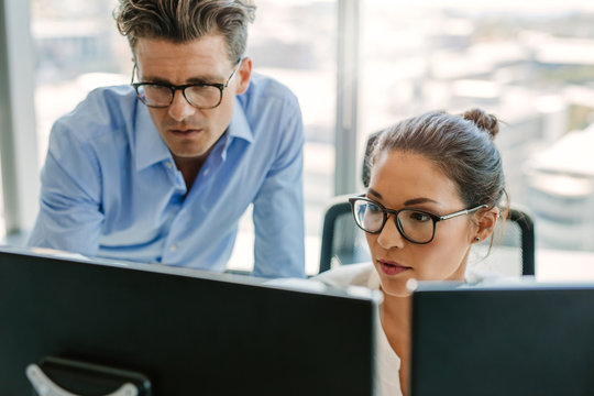 Focused Business Team Using A Computer In Office