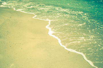 Edge of sea waves on a sandy beach