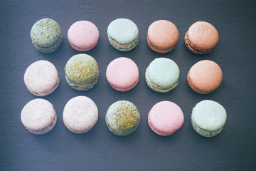 Macarons cake, top view flat lay, pattern macaroon, black background