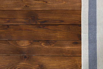 Background with empty wooden table with tablecloth