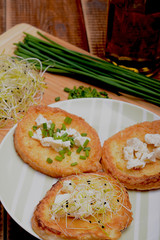 French toasts with goats cheese, fresh chives and sprouts.