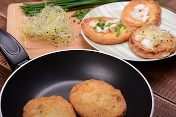 French toasts with goats cheese, fresh chives and sprouts.