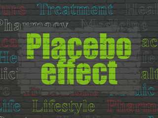 Medicine concept: Placebo Effect on wall background