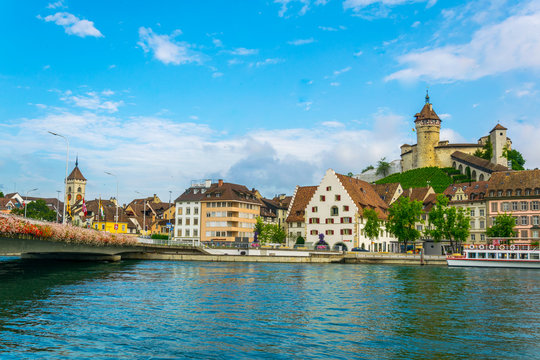 The munot fortress in the swiss city schaffhausen is reflected on the rhine river in summer.