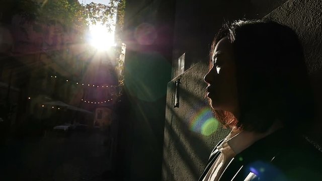 Sad and thoughtful Asian woman in the dark,portrait 