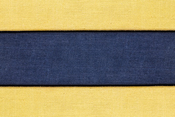 Fototapeta premium Blue and yellow checkered canvas fabric material. Empty copy space background.