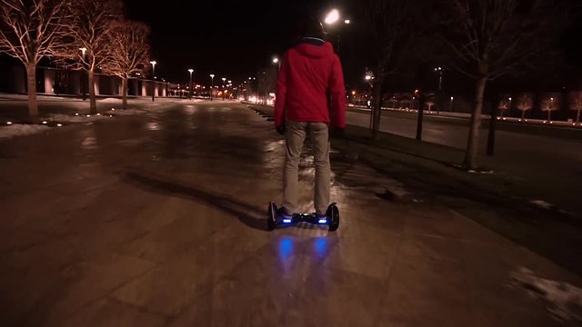 A man rides a night on gyrometer