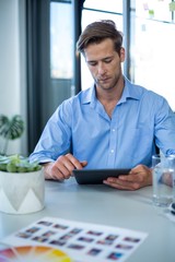 Fototapeta premium Male graphic designer using digital tablet