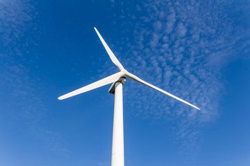 Wind turbine with blue sky - renewable energy