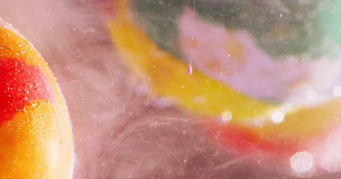 Abstract spherical models made of plasticine, immersed in liquid. Closeup. 4K. Camera RED.
