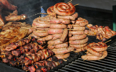 stall on the street selling cooked meat and sausage